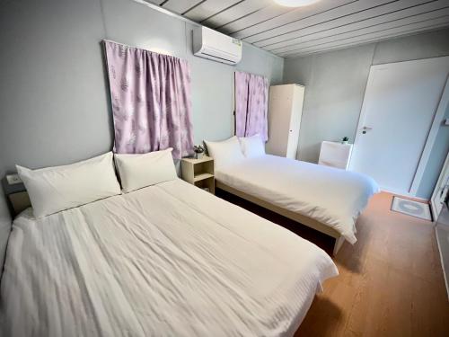 Ein Bett oder Betten in einem Zimmer der Unterkunft 鉄木彩虹小屋