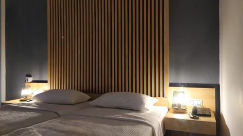 Postel nebo postele na pokoji v ubytování Hotel Plaza