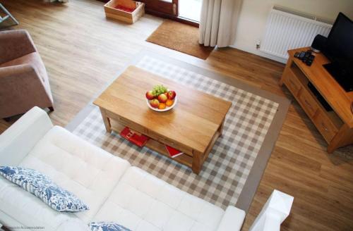 a bowl of fruit on a coffee table in a living room at Whitedown in Alton