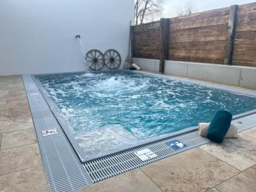 a large swimming pool with blue water at Arnfels Residences am Tor zur Südsteirischen Weinstraße in Arnfels