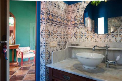 a bathroom with a sink and a mirror at Villa African Queen - St Barth in Gustavia