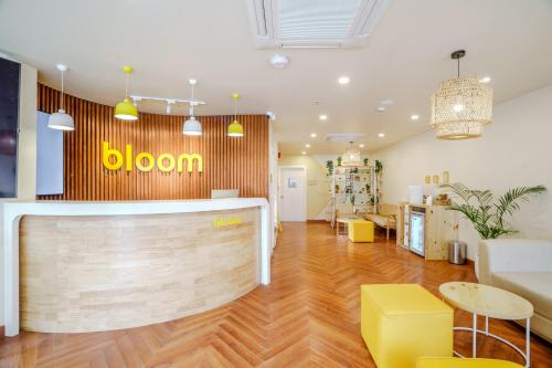 a store with a yellow sign on the wall at Bloom Hotel - Karol Bagh in New Delhi