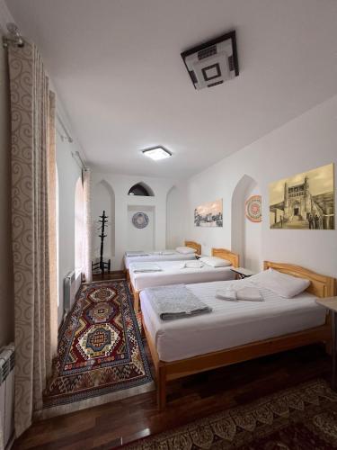 Ένα ή περισσότερα κρεβάτια σε δωμάτιο στο Rumi Hotel & Hostel