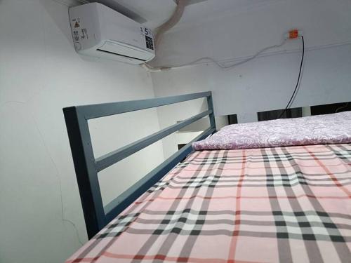 Ein Bett oder Betten in einem Zimmer der Unterkunft EarlyHome@Adena- Graha Raya