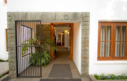 a entrance to a house with a iron gate at Ellen’s Place in Colombo