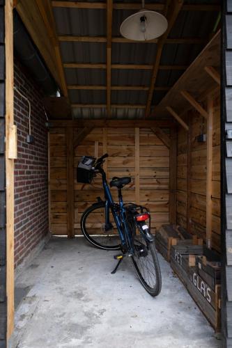 a bike is parked in a garage at Op d'n Stolberg in Weert