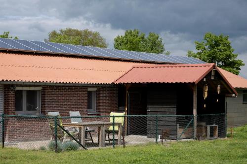 a house with solar panels on top of it at Op d'n Stolberg in Weert