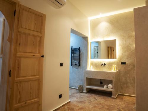 a bathroom with a sink and a mirror at Riad Zhor Tanger - Médina in Tangier