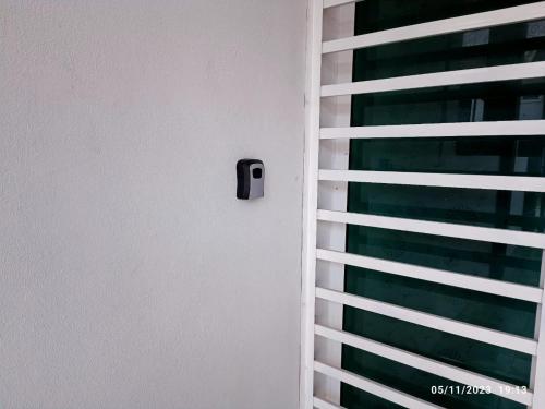 a room with a window with blinds at HOMESTAY NAFISAH in Tapah Road