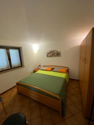 a bedroom with a bed in a room at Alloggio Turistico La Balocca in Montefiascone