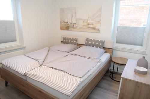 Ένα ή περισσότερα κρεβάτια σε δωμάτιο στο Strandfloh