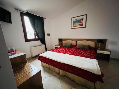 Postel nebo postele na pokoji v ubytování Hotel Le Corti