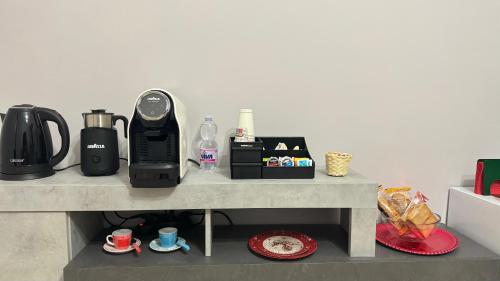 a counter top with a coffee maker and a blender at C’era Una Volta Affittacamere in Colle di Tora
