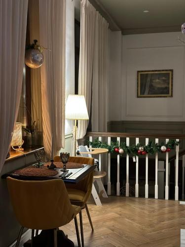 a dining room with a table and chairs and a radiator at La Fontaine in Hunedoara