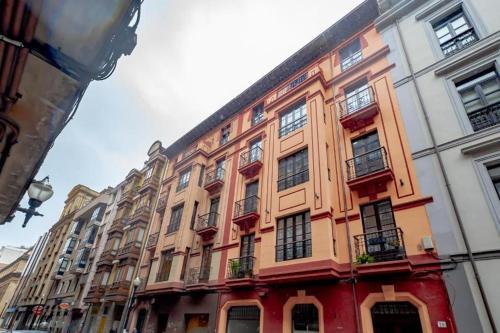a large building on the side of a street at Apartamentos JAP Begoña in Gijón