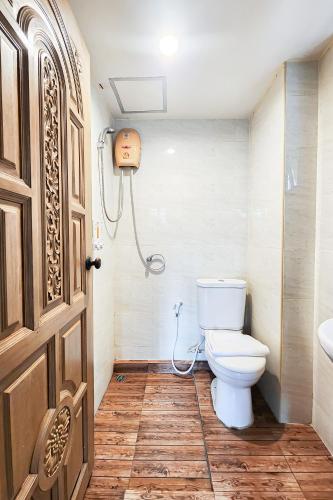 a bathroom with a toilet and a sink at Cordia Residence Sathorn in Bang Rak