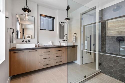 a bathroom with a sink and a glass shower at Hotel Whiskey in Park City