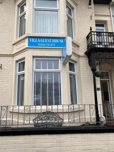 a villa guest house sign on a building at Villa Guest House in Porthcawl