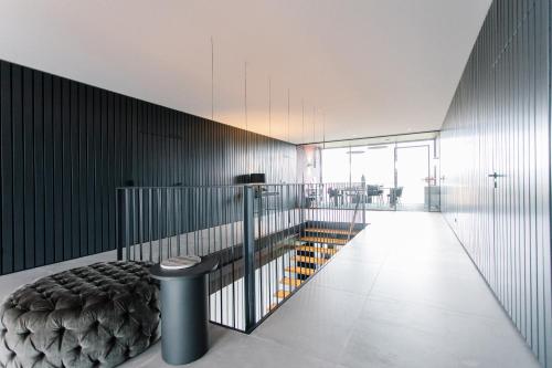 a room with a bed and a hallway with glass at Exklusive Design Appartement Palm Paradise Neubau in Pfungstadt