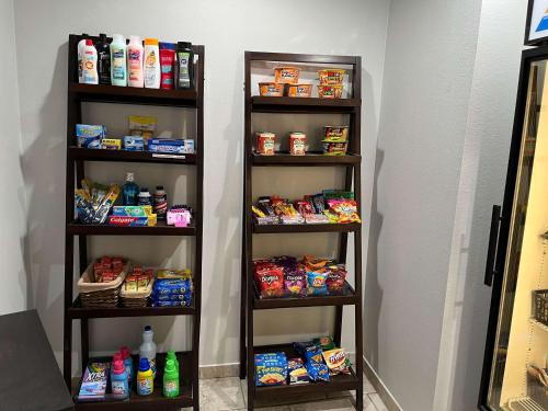 a room with two shelves with food and drinks at Motel 6 Junction, TX Llano River in Junction