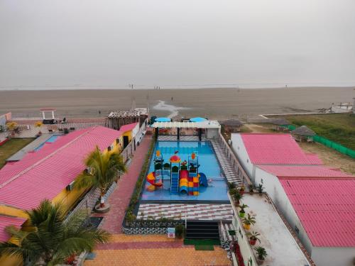 an overhead view of a water park with a pool at Hindusthan Inn - On Beach in Mandarmoni