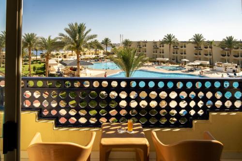 a view from the balcony of a resort with a bunch of wine bottles at Grand Oasis Resort in Sharm El Sheikh