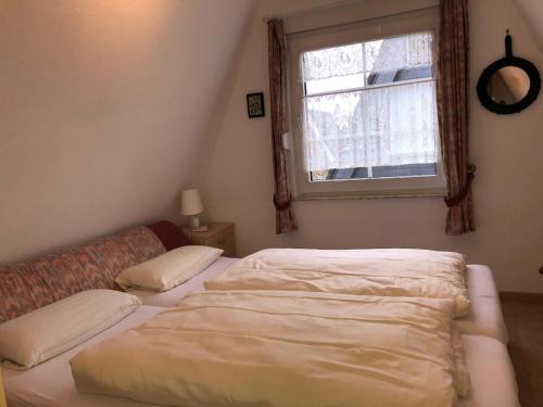 Postel nebo postele na pokoji v ubytování Am Ringwall 6