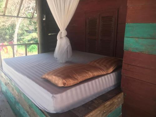 Postel nebo postele na pokoji v ubytování Naks Shack