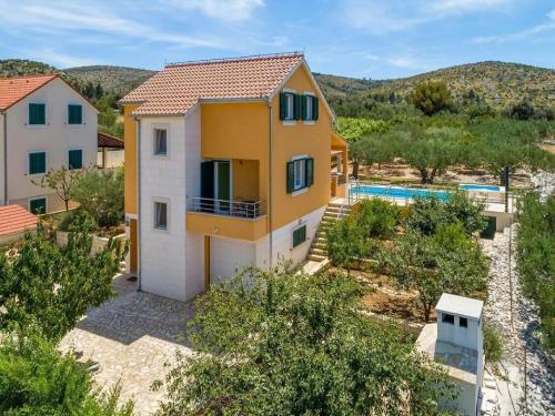 an aerial view of a house with a swimming pool at Villa Jelena in Dračevica