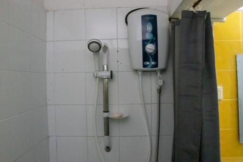 a shower in a bathroom next to a shower at Serene Sea View By Chana in Colombo