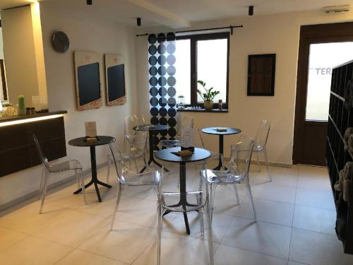 a dining room with two tables and chairs at Apartmán Wellness Veselí in Veselí nad Moravou