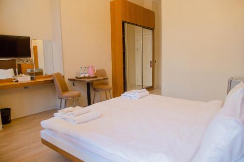 Postel nebo postele na pokoji v ubytování Solo Hotel