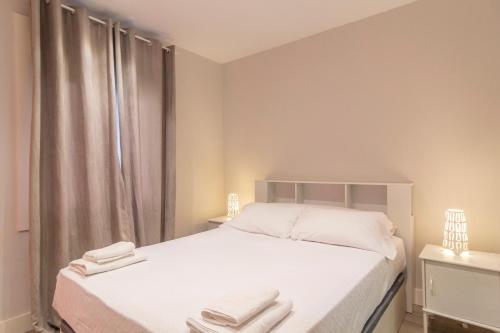 Un pat sau paturi într-o cameră la APARTAMENTO HOLIDEA CALLE BONIFAZ