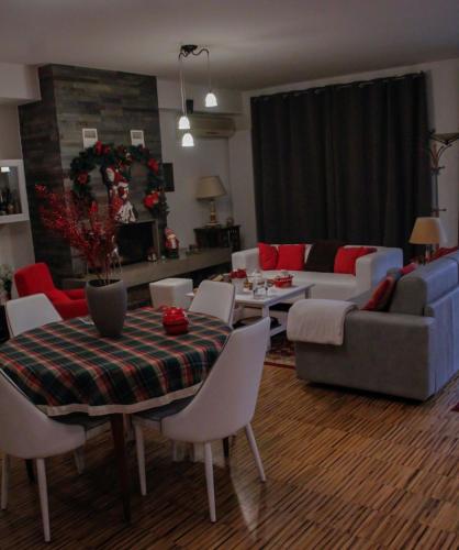a living room with a couch and a table and chairs at VillaTonia - Suite home in Molfetta