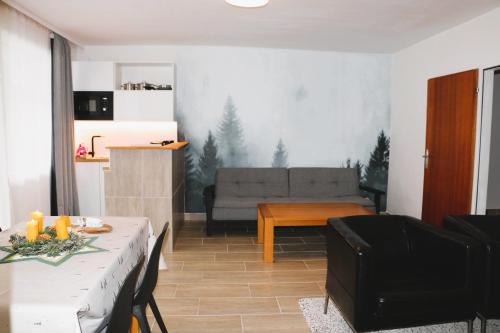 a living room with a couch and a table at Tauern in Kaprun