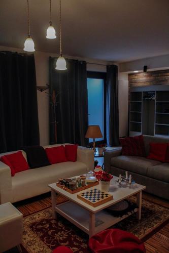a living room with a couch and a table at VillaTonia - Suite home in Molfetta