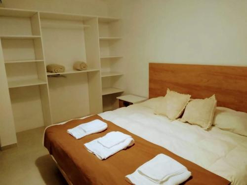 Ein Bett oder Betten in einem Zimmer der Unterkunft La Vie - Casa de Mar