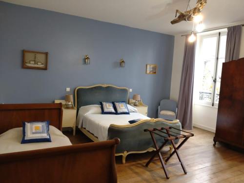 Ліжко або ліжка в номері La brasserie chambre d'hotes de Delphine