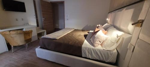 a bedroom with a large bed in a room at Villa Nasti Luxury Bed Taurasi Room in Nocera Inferiore
