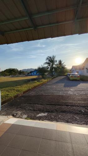 a car parked on the side of a road at Yamad Homestay Langkawi in Kuah