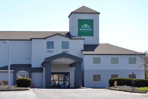 a building with a sign that reads warehouse at Wingate by Wyndham Bel Air I-95 Exit 77A - APG Area in Edgewood