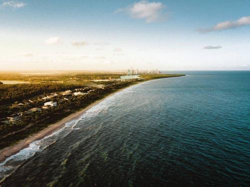 an aerial view of an island in the ocean at Reserva do Paiva suites in Cabo de Santo Agostinho