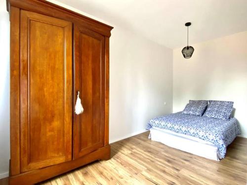 Ένα ή περισσότερα κρεβάτια σε δωμάτιο στο Appartement 2 chambres complet chic et cosy