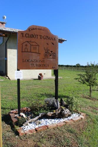 a sign in the middle of a field at 'L ciabot 'd Ginota in Barge
