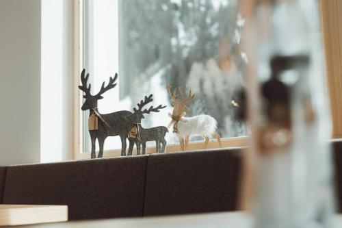 a figurines of animals on a window sill at Apart Himmel-Raich in Kaunertal