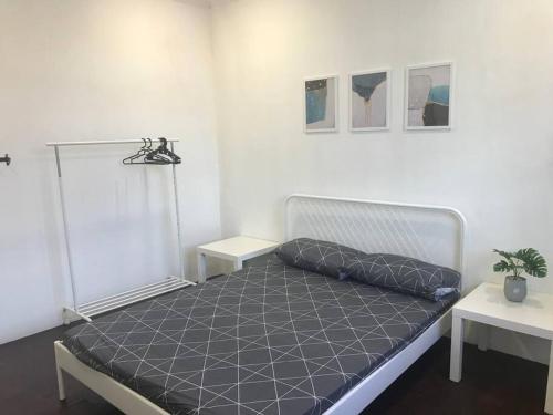 a bedroom with a bed in a room at Dahlia Homestay (Wi-Fi & Netflix) in Miri