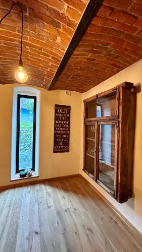 a room with a chalkboard on the wall and a window at Der Hof am Wald in Weichselbaum