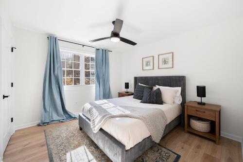 a bedroom with a bed and a ceiling fan at Smart Home in Heart of Snellville in Snellville