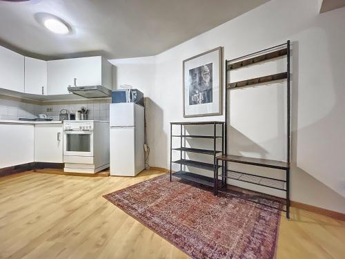 a room with a bunk bed and a kitchen at Cosy Apartment Brussels - Flagey in Brussels