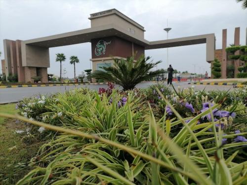 a flower garden in front of a building at AS Plaza in Gujrānwāla